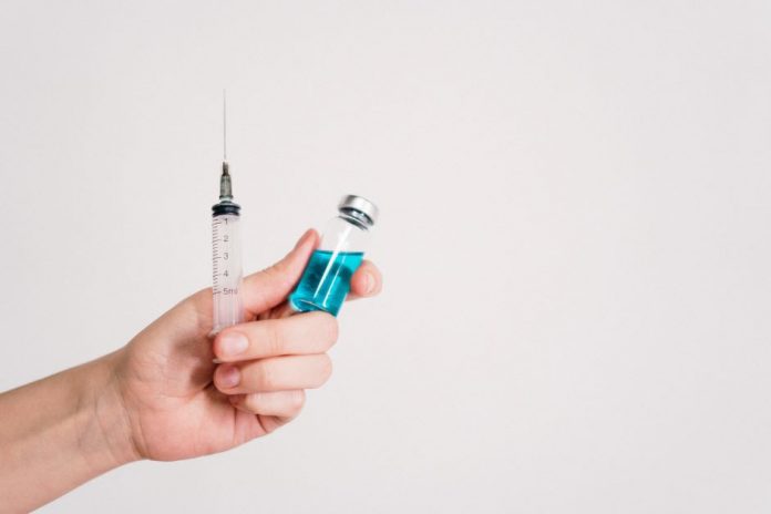 A vaccine needle and vial.