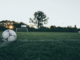 Football chiefs call full time on season for lower leagues A close up shot of a football in front of a goal.