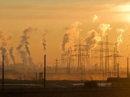 Climate change role ‘too much’ for one person Pollution above electricity pylons and industrial chimneys.