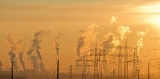 Climate change role ‘too much’ for one person Pollution above electricity pylons and industrial chimneys.