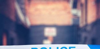 Police attempting to reassure lone women Police Tape In Urban Alley