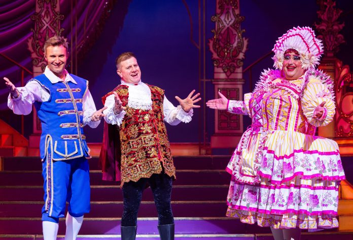 Jonathan Wilkes as Buttons, Kai Owen as Dandini and Christian Patterson as Baroness Heiffer Hardup.