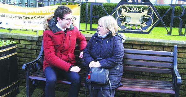 Chronicle reporter James Connolly chats with a stranger on the bench.