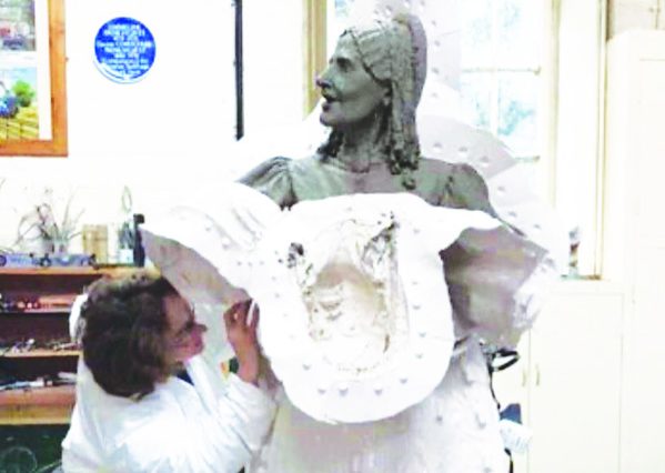 Ms Reeves at work on the statue.
