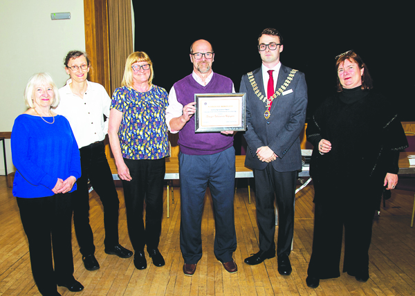 Coun Unett, second from right, presented, Alsager Welcomes Refugees representative, from left, Diane Selby, Wendy Campbell, Liz Richardson and Tony Smith with the community civic award.