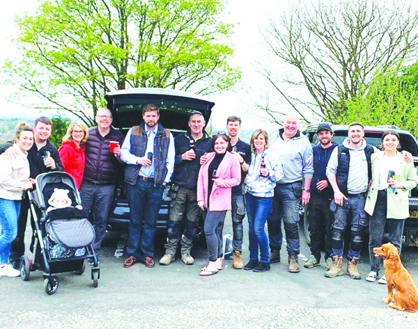 Celebrating: Mr Stonex, fifth from left, with former regulars in the Coach and Horses car park after announcing he had bought the pub. (Photo: Belinda Long).