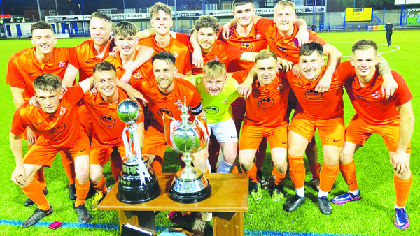 Teamwork: AFC Alsager show off the league and cup trophies.