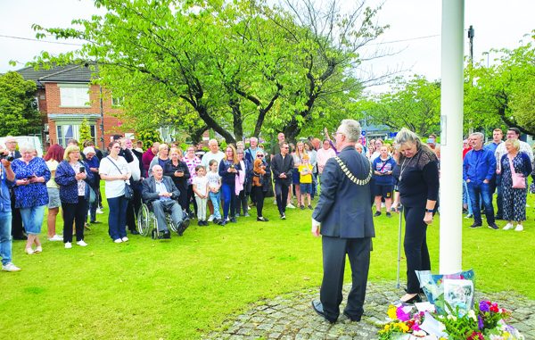 Coun Williams addresses those who had gathered on the green near Alsager's council offices for the historic occasion.