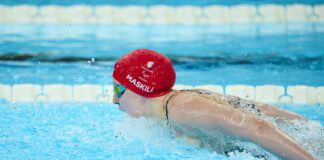 Paralympian Polly swims off with MBE
