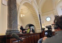 Anti-racism protestors bring meeting to a halt